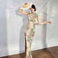 A cyan floral qipao gown for summer.