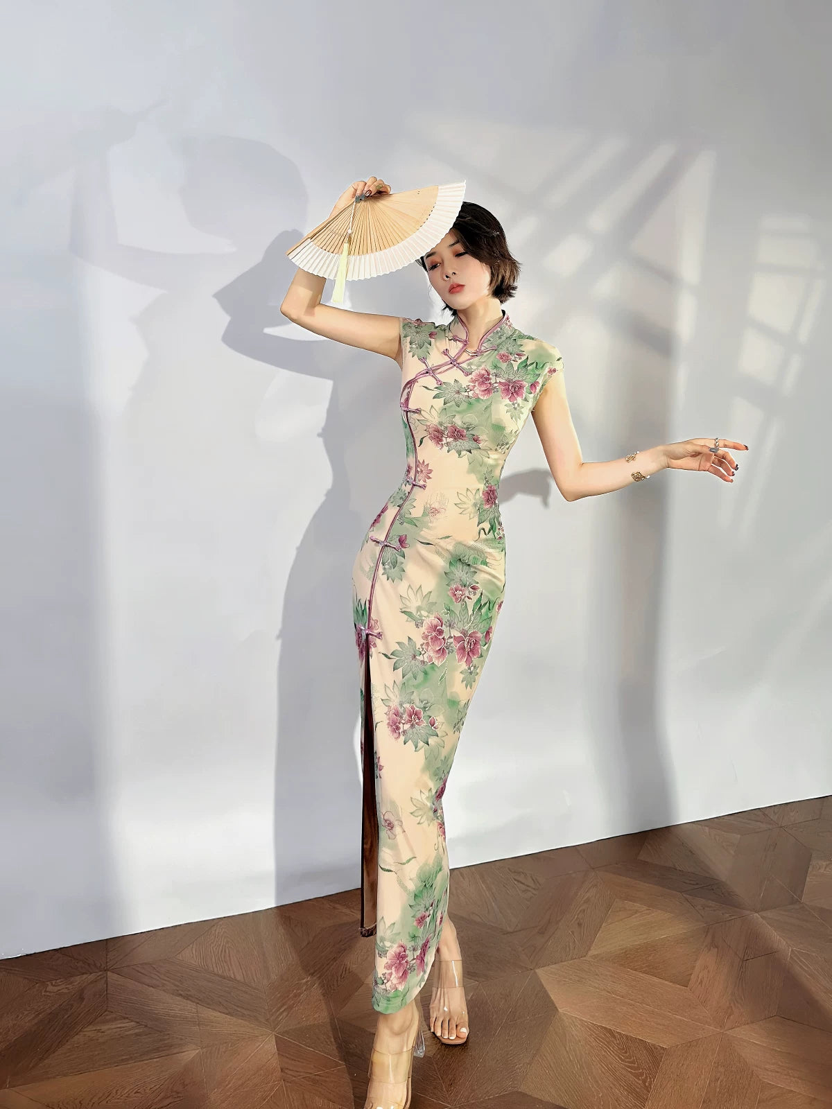 A cyan floral qipao gown for summer.