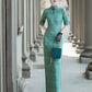 Tailoring a modern blue-green qipao gown for you.