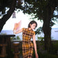 Modern qipao gown with a yellow plaid pattern