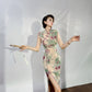 A cyan floral qipao gown for summer.
