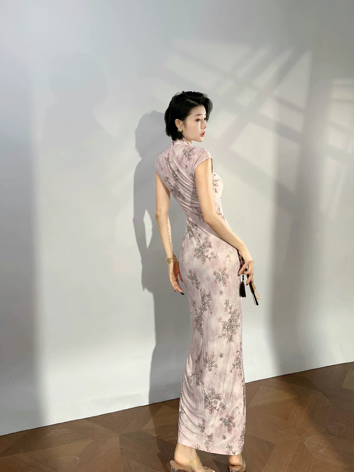Modern qipao gown with a pink floral pattern