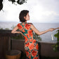 Modern qipao gown with red floral patterns