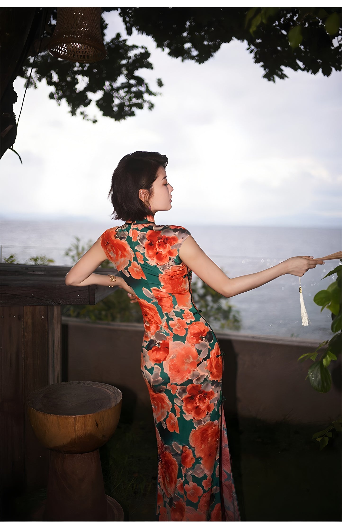 Modern qipao gown with red floral patterns