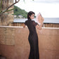 Modern qipao gown with a black plaid print.