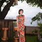 Modern qipao gown with red floral patterns