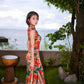 Modern qipao gown with red floral patterns