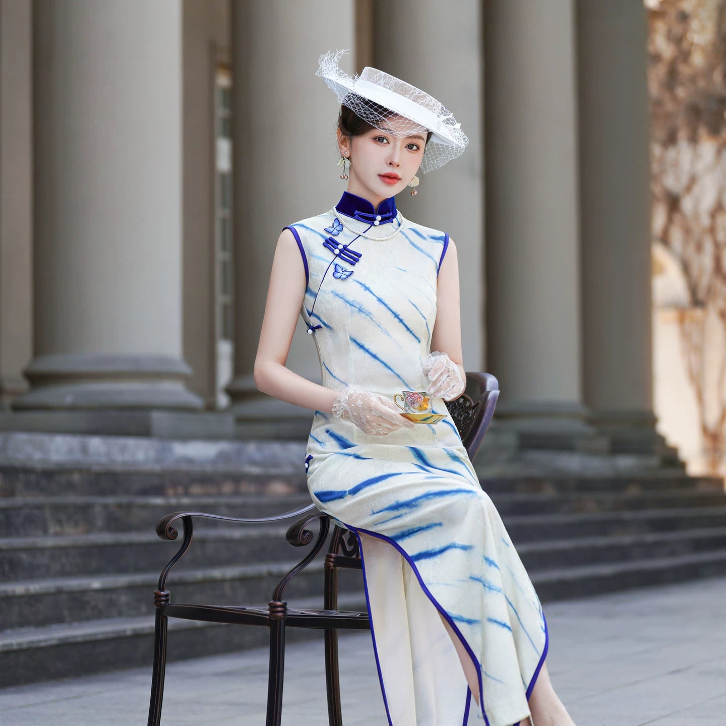 White sleeveless modern qipao gown
