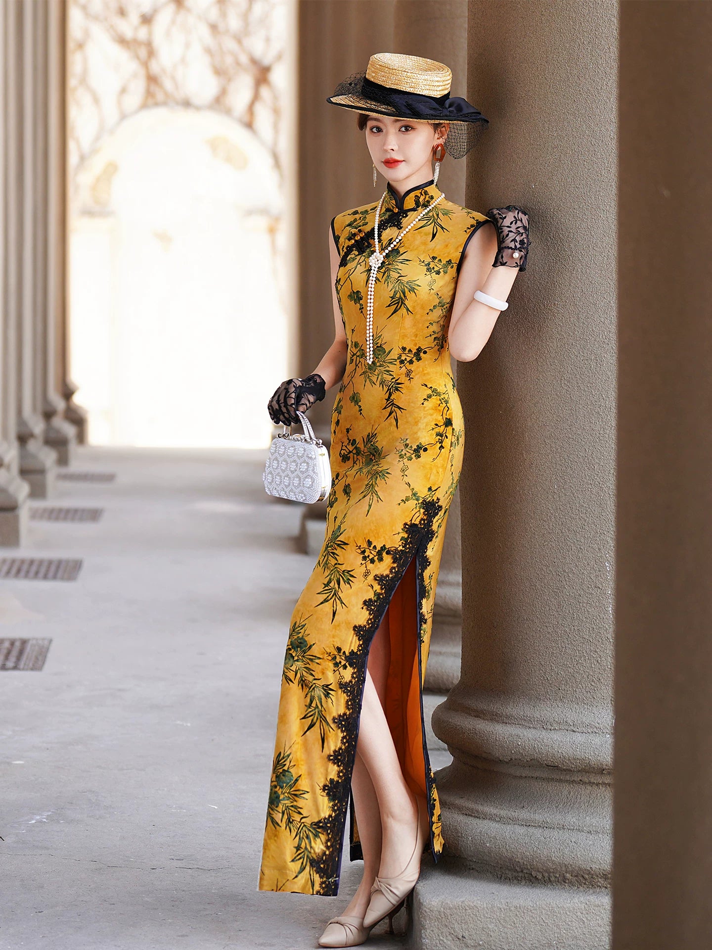 Yellow sleeveless modern qipao with a bamboo print.