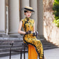 Yellow sleeveless modern qipao with a bamboo print.