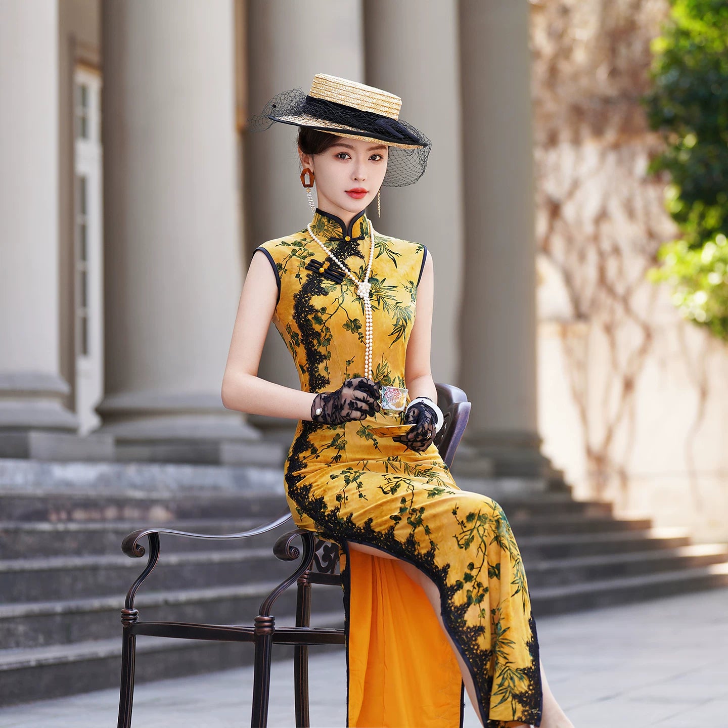 Yellow sleeveless modern qipao with a bamboo print.