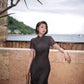Modern qipao gown with a black plaid print.