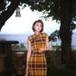 Modern qipao gown with a yellow plaid pattern
