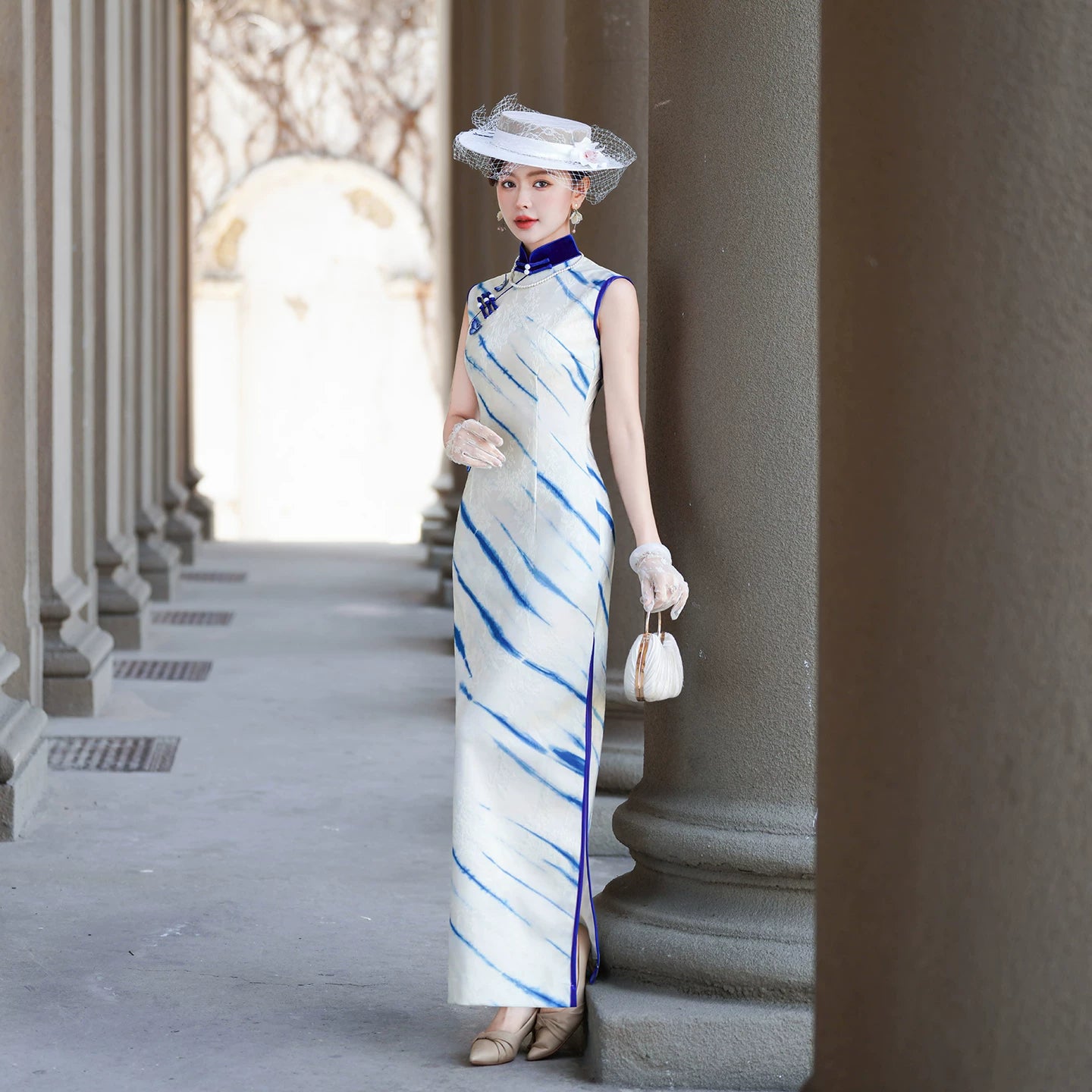 White sleeveless modern qipao gown