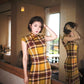 Modern qipao gown with a yellow plaid pattern