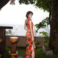 Modern qipao gown with red floral patterns
