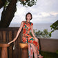 Modern qipao gown with red floral patterns