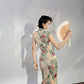 A cyan floral qipao gown for summer.