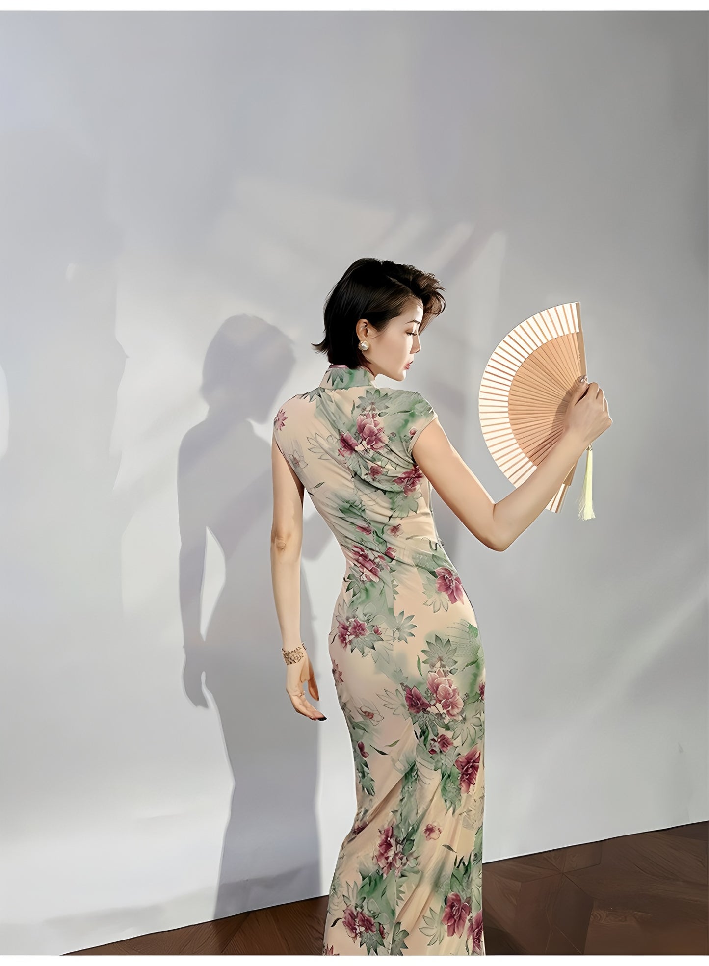 A cyan floral qipao gown for summer.