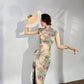 A cyan floral qipao gown for summer.