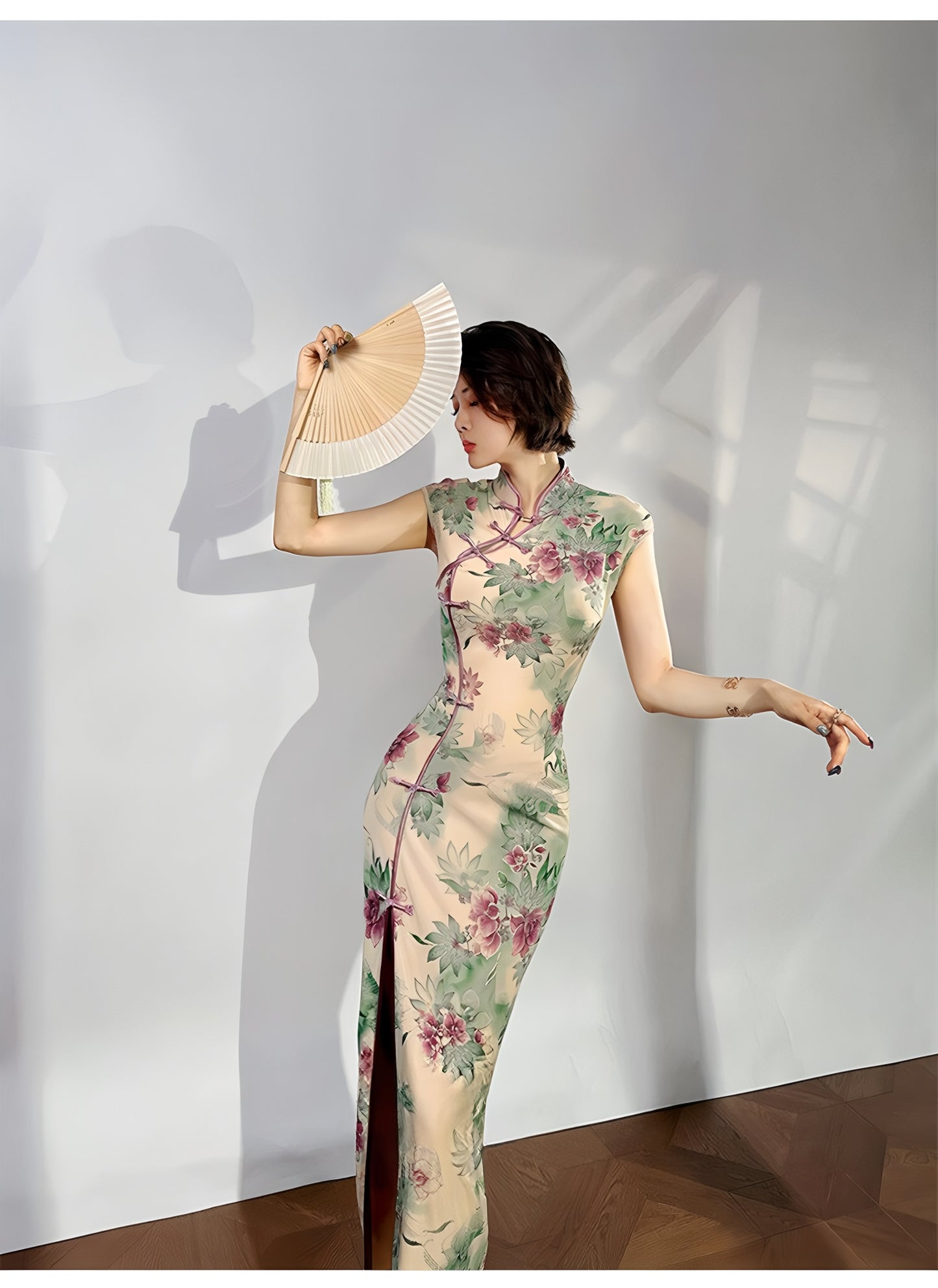 A cyan floral qipao gown for summer.