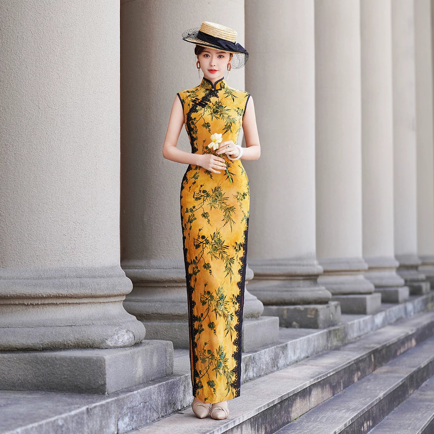 Yellow sleeveless modern qipao with a bamboo print.