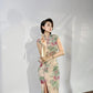 A cyan floral qipao gown for summer.