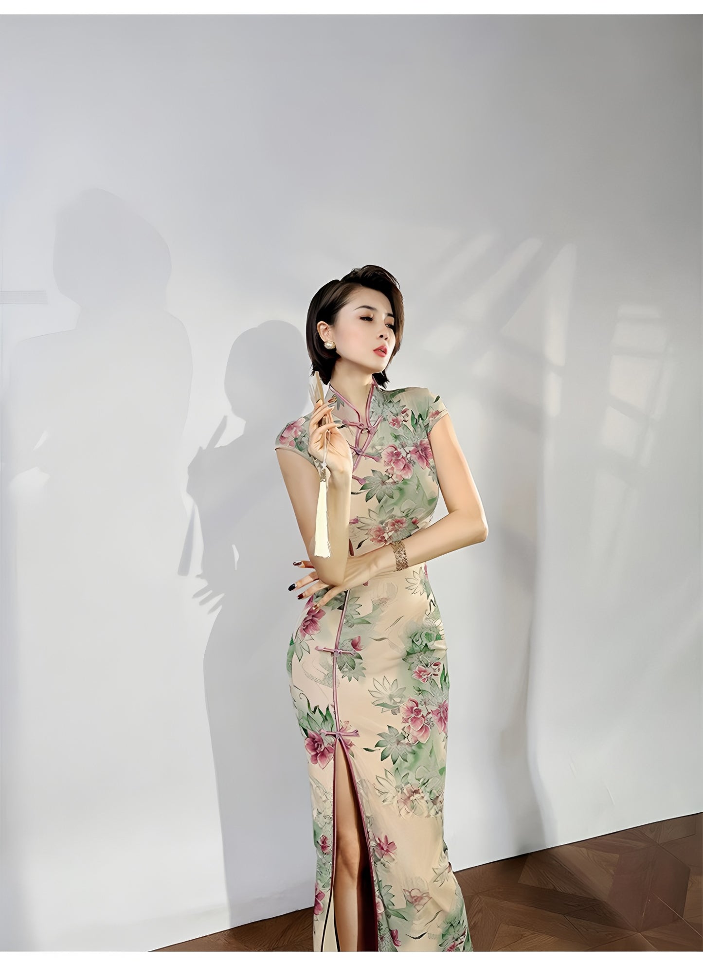 A cyan floral qipao gown for summer.