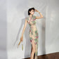 A cyan floral qipao gown for summer.