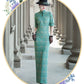 Tailoring a modern blue-green qipao gown for you.