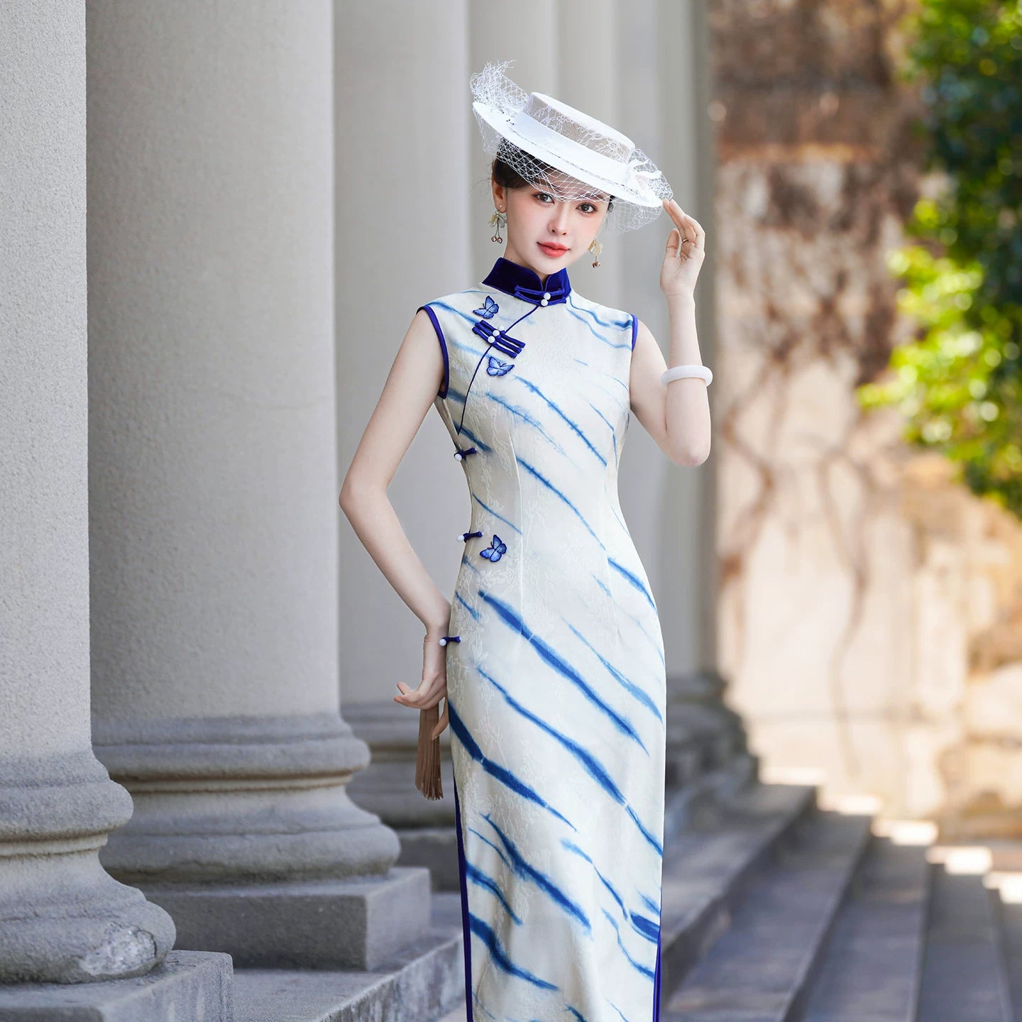 White sleeveless modern qipao gown