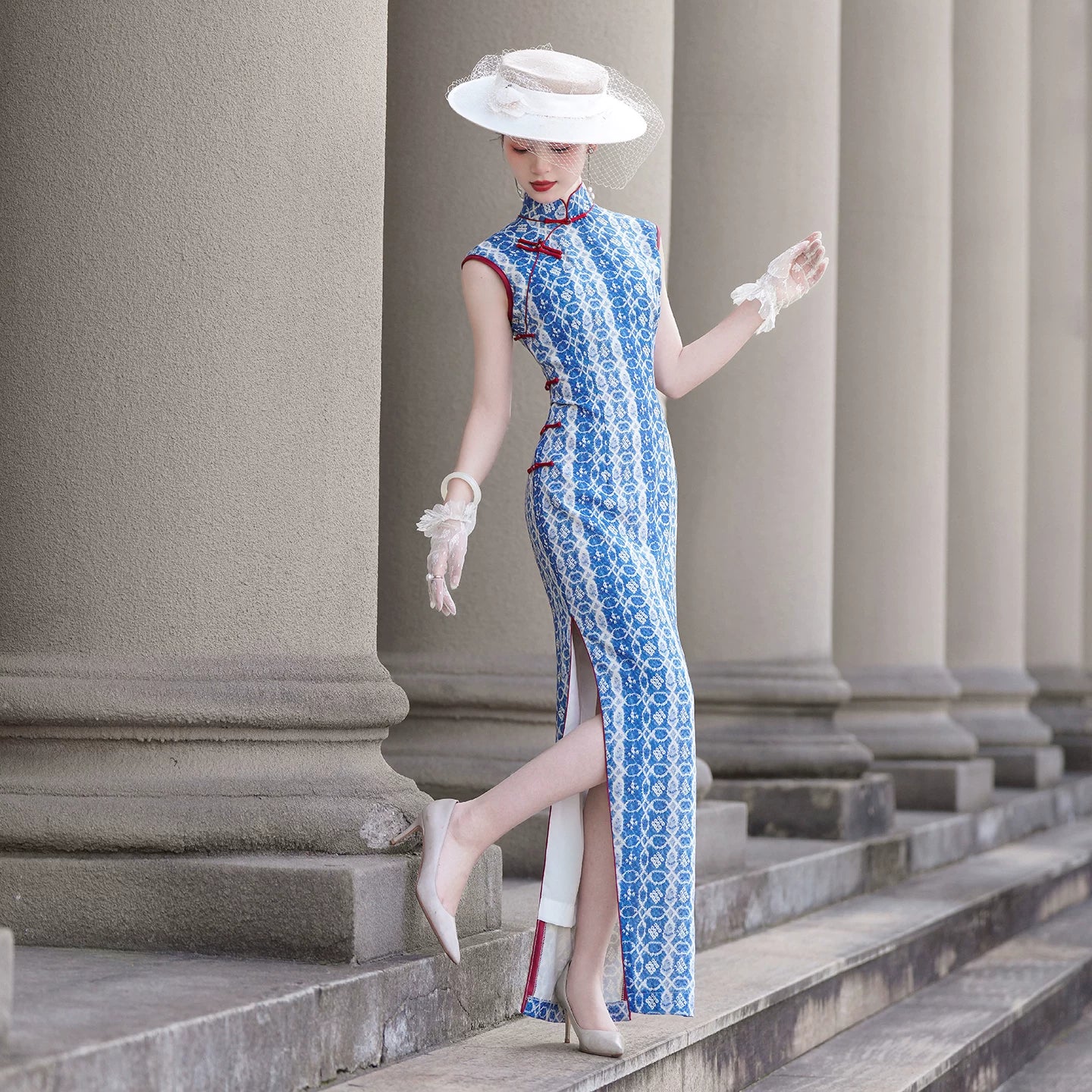 Blue sleeveless full-length qipao gown