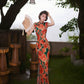 Modern qipao gown with red floral patterns