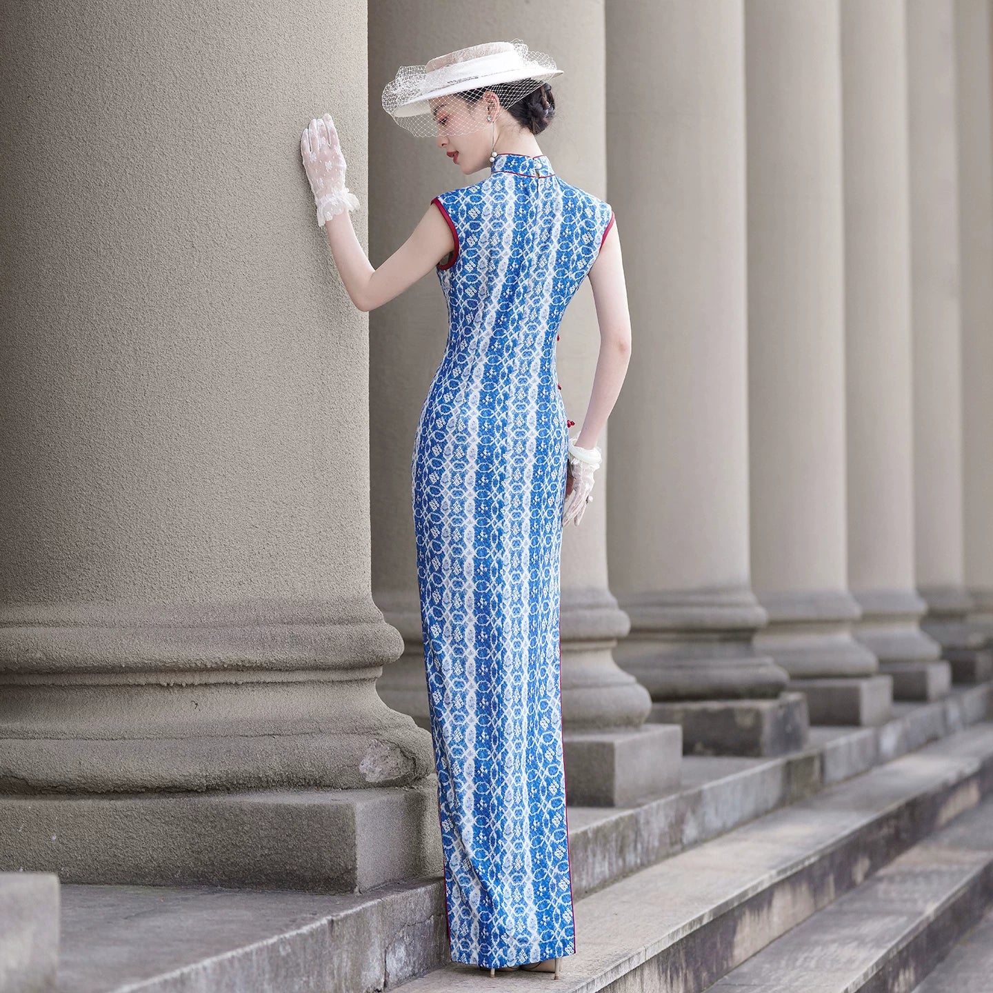 Blue sleeveless full-length qipao gown