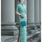 Tailoring a modern blue-green qipao gown for you.