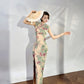 A cyan floral qipao gown for summer.
