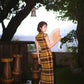 Modern qipao gown with a yellow plaid pattern