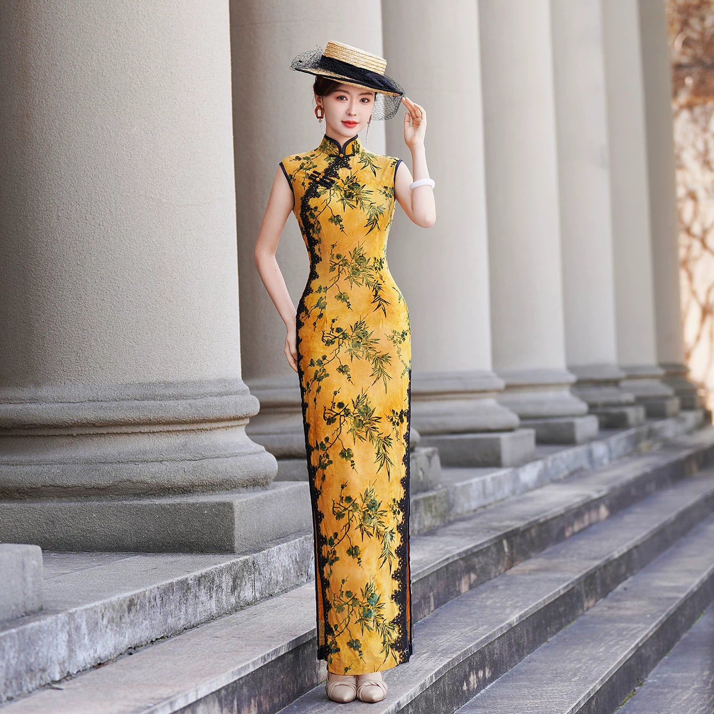 Yellow sleeveless modern qipao with a bamboo print.