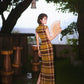 Modern qipao gown with a yellow plaid pattern