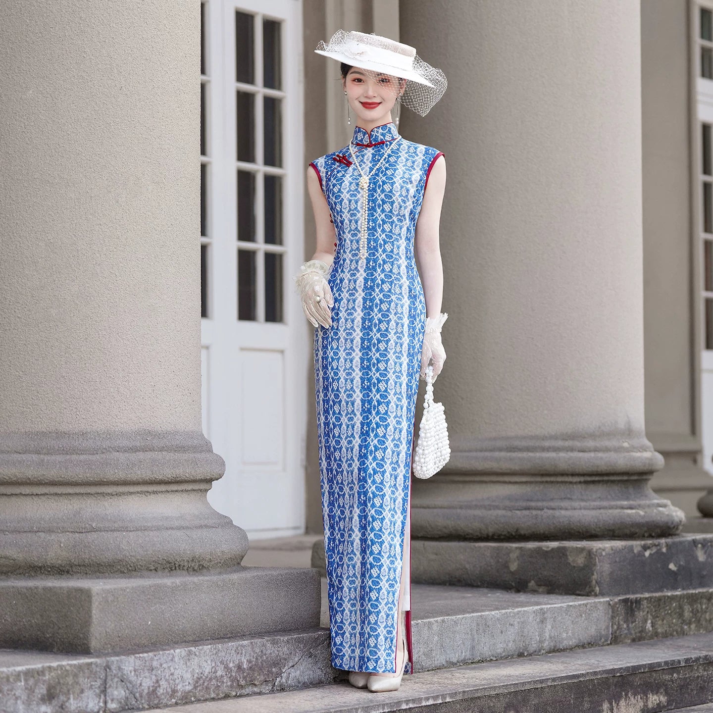 Blue sleeveless full-length qipao gown