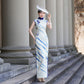 White sleeveless modern qipao gown