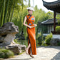Orange sleeveless modern qipao gown