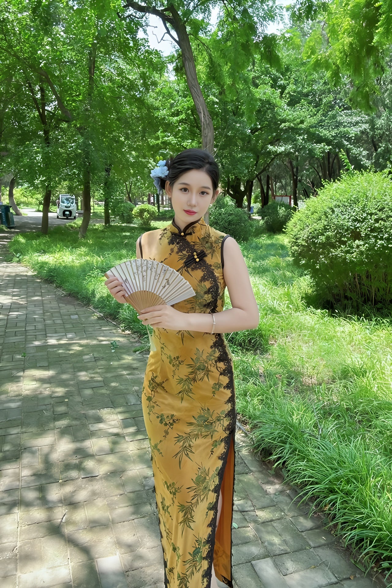 Yellow sleeveless modern qipao with a bamboo print.