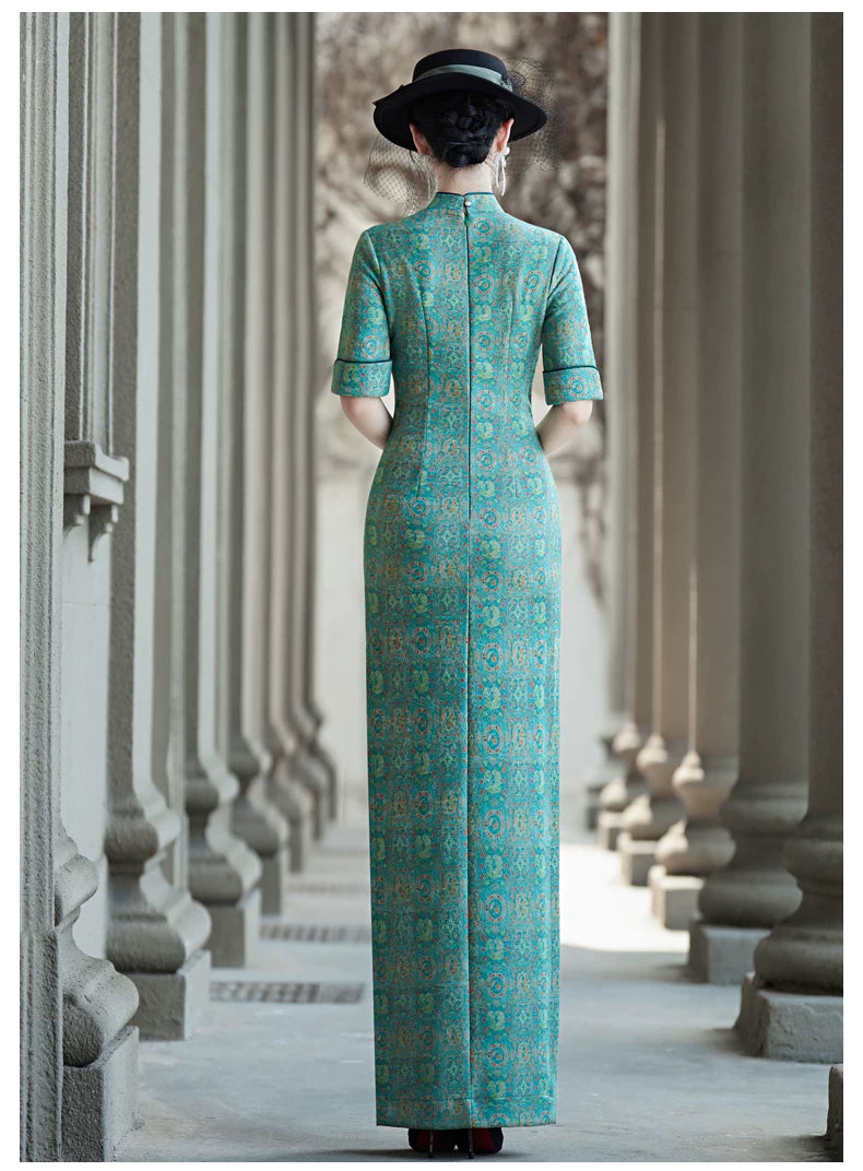 Tailoring a modern blue-green qipao gown for you.