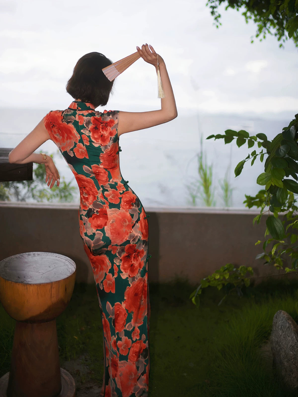 Modern qipao gown with red floral patterns