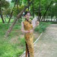 Yellow sleeveless modern qipao with a bamboo print.