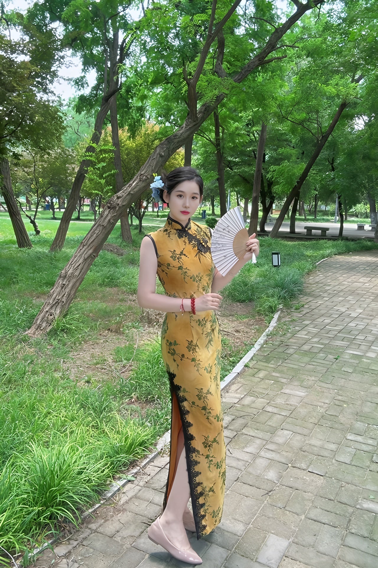 Yellow sleeveless modern qipao with a bamboo print.