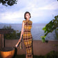 Modern qipao gown with a yellow plaid pattern