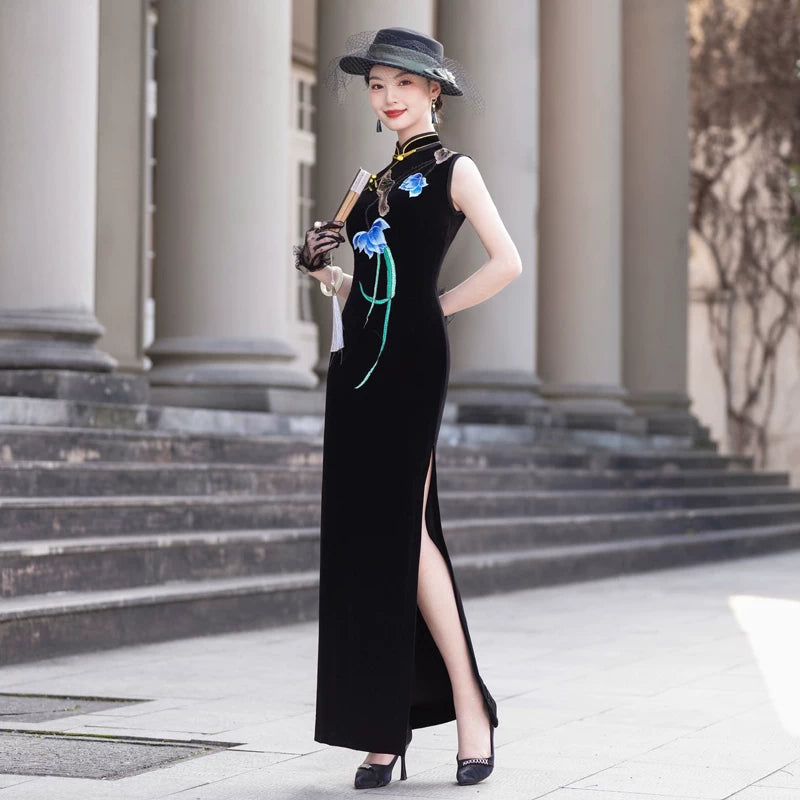 Sleeveless black velvet modern qipao featuring lotus embroidery.