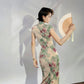 A cyan floral qipao gown for summer.